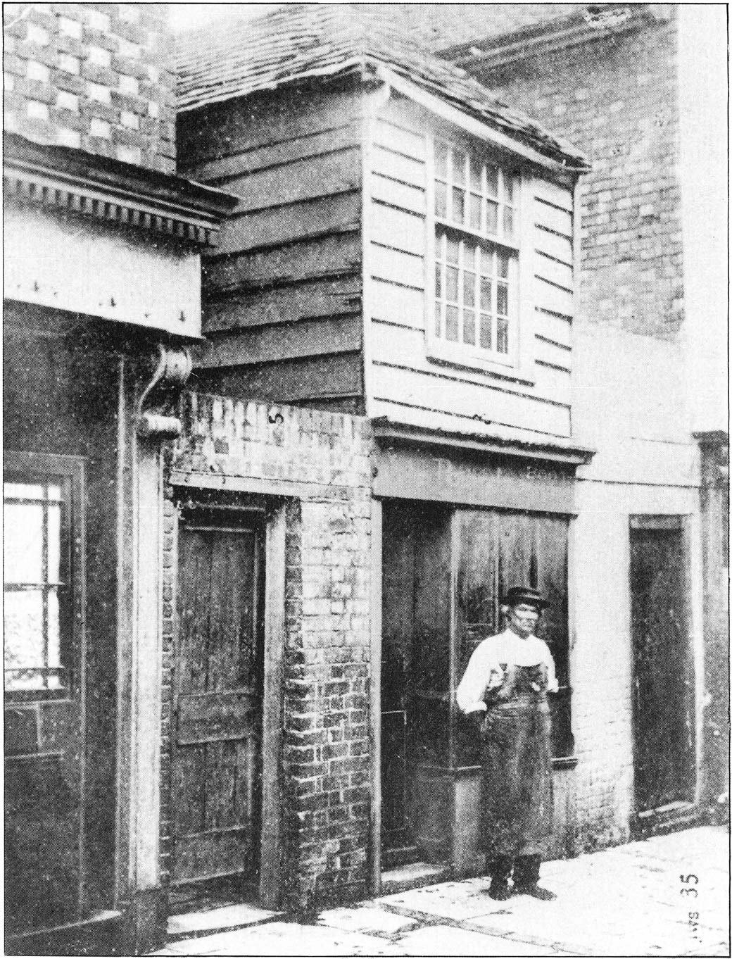 Unknown man outside John Pounds' shop, Highbury Street, Old Portsmouth.